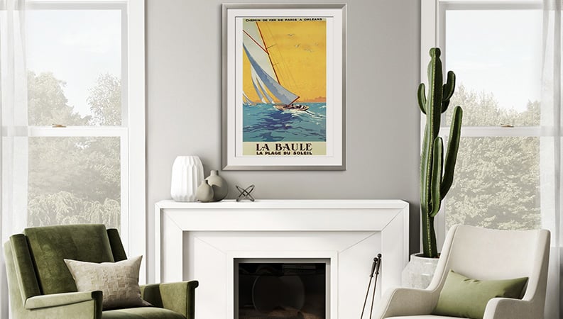 Vintage sailboat art hanging above fireplace linking to vintage art products